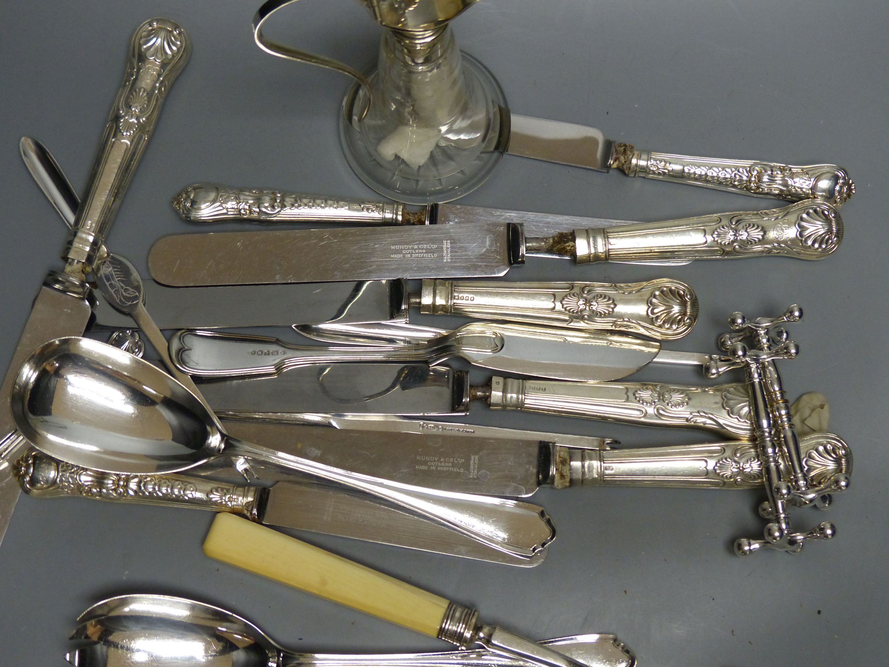 A small collection of silver and plated flatware, including a pair of silver Kings pattern jam spoons,